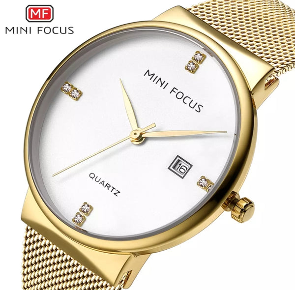 Mini focus Gold dial gold mesh bracelet analog woman watch.